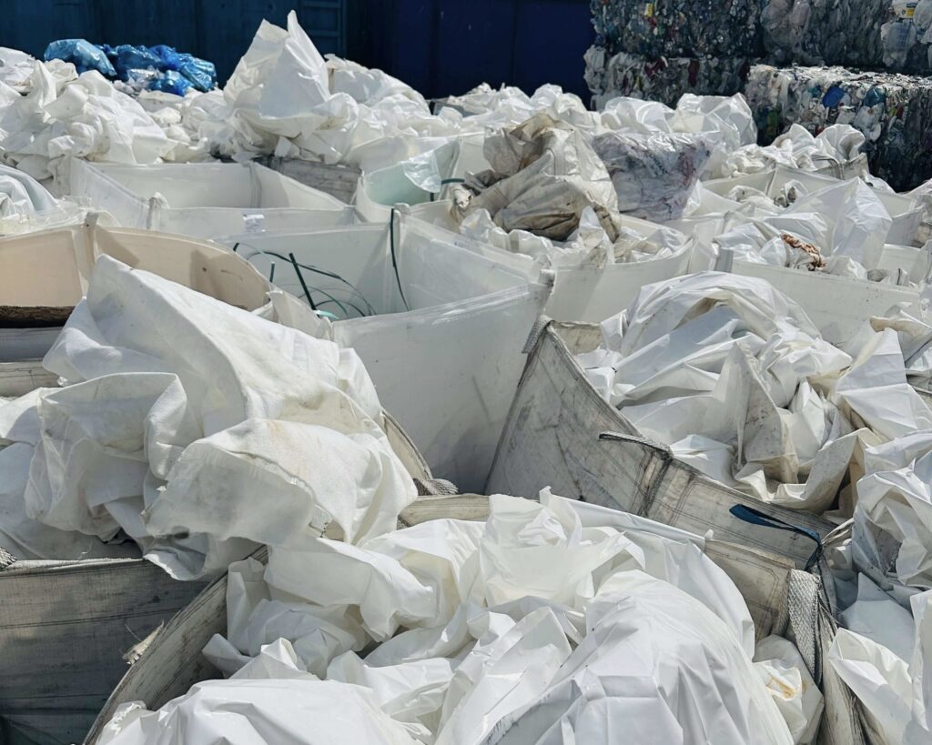 Sorted construction plastics in bulk bags.